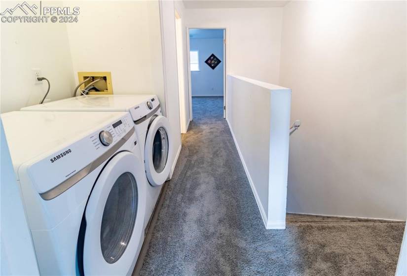 Washroom with dark carpet, separate washer and dryer, and hookup for a washing machine