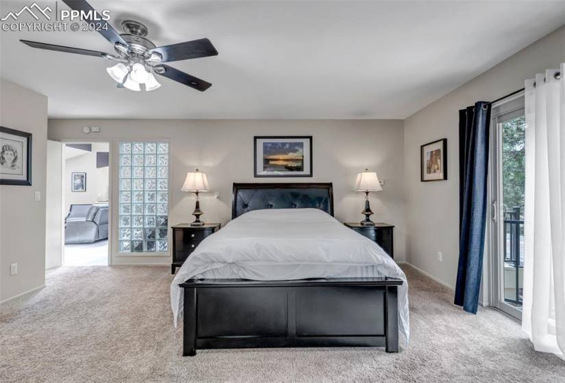 Bedroom featuring ceiling fan and light carpet