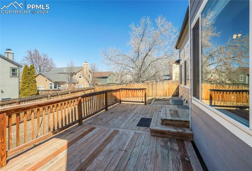 Large wooden deck off the kitchen and family roomm