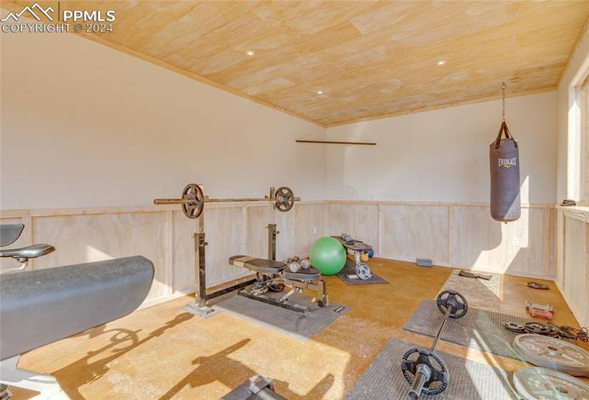 Exercise room featuring wooden ceiling