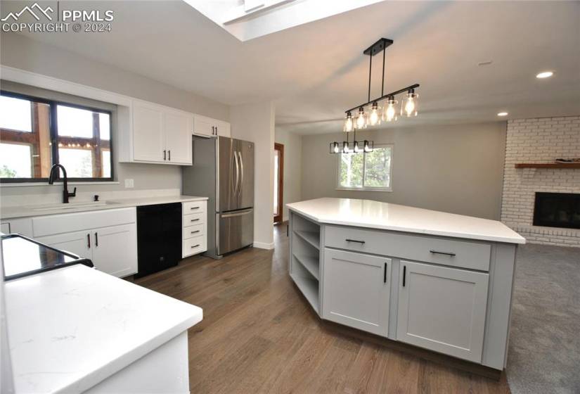 Kitchen featuring stainless steel appliances, granite counters and New light fixture