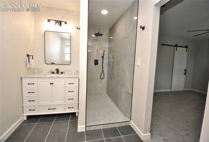 Bathroom with vanity, tile floors and Custom walk in shower