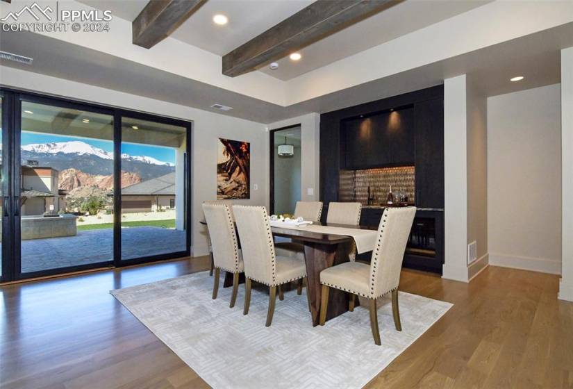 Main floor Dining area with beamed ceiling and hardwood floors allows for multiple dining venues for entertaining.