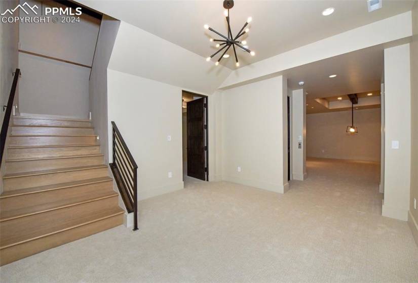 White Oak stair case with smart lighting to lower level and elevator as well