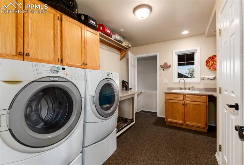Laundry/mud room off garage with lots of storage.