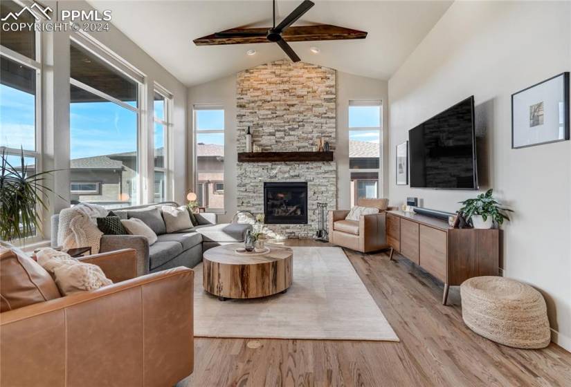 Soaring Vaulted ceilings in the Great Room adorned w/wood beam accents, floor-to-ceiling stacked stone gas fireplace maximizes the scenic setting while emphasizing comfort