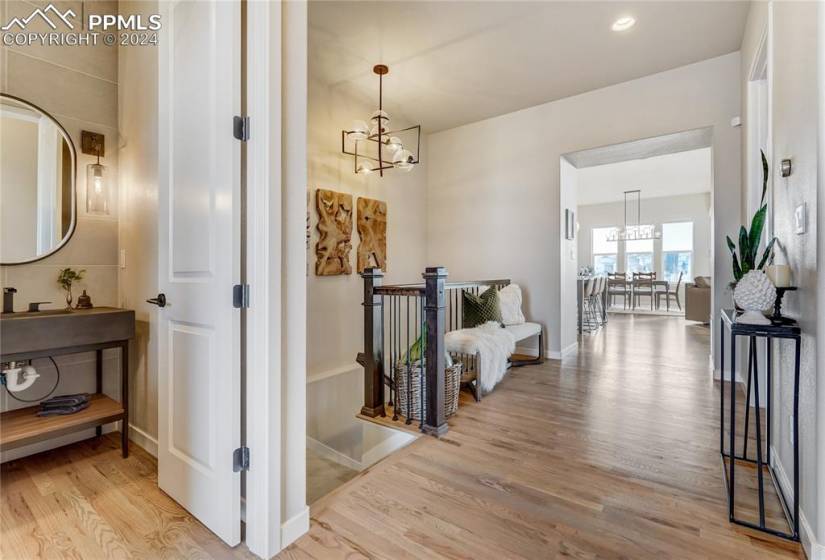 Upon entry you are greeted with Gleaming Hardwood Floors Throughout the Main, 9'-10’ Main Level Ceilings, 8' Solid Core Doors on the Main + Sleek Black Door Hardware Throughout