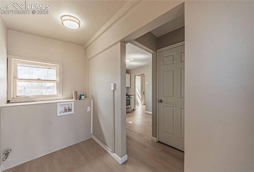 Corridor featuring light hardwood / wood-style floors