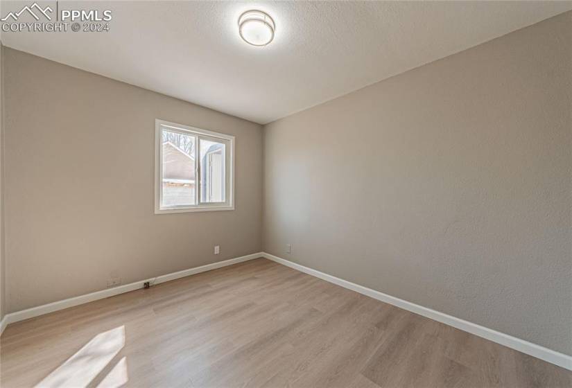 Spare room with light wood-type flooring