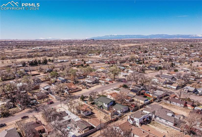 Birds eye view of property with a mountain view