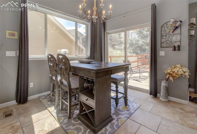 Dining area with a walk out patio to the fenced backyard!