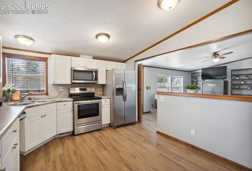 Eat-in kitchen that opens to the living room & Laundry Room w/ access door to garage