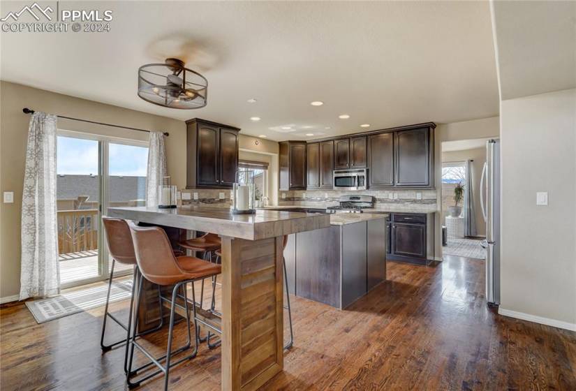 Beautiful granite, 42 in uppers and a pantry with fabulous hardwood flooring.  Walk out to the amazing composite deck.