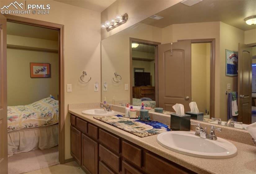 Jack and Jill Bathroom with double vanity and tile floors
