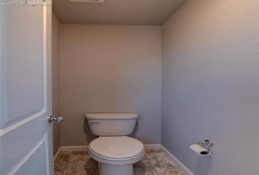 Bathroom with tile flooring and toilet