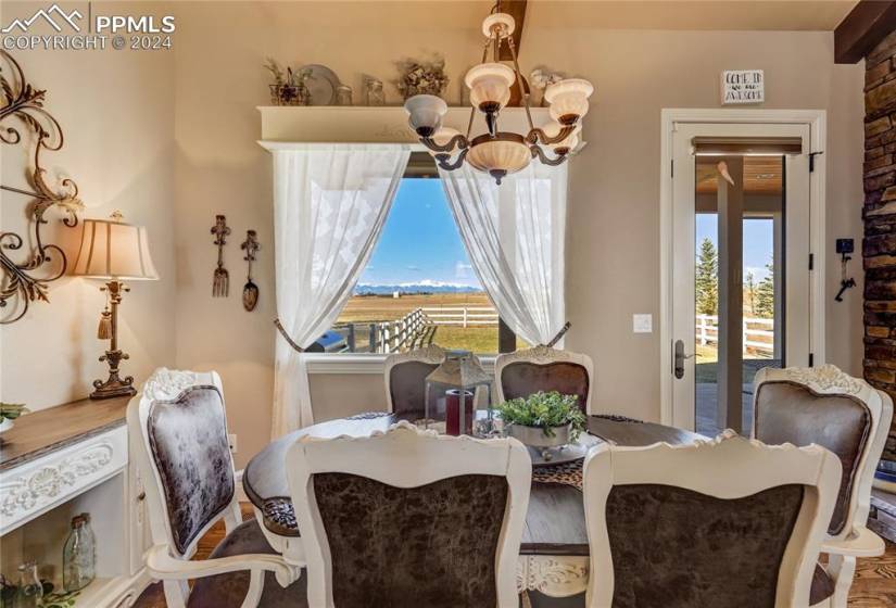 Dining Area Open to Kitchen and Great Room w/Stunning Views of Pikes Peak + Overlooks Peaceful Backyard