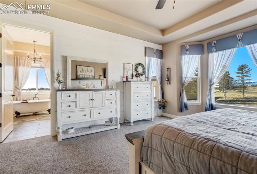 Opens to 5pc Ensuite featuring a Clawfoot Bathtub, Zero Entry Walk-in Shower w/Dual Showerheads | Slate Tile Floors | Expansive Vanity w/Dual Copper Vessel Sinks, Granite Countertop + Framed Mirrors
