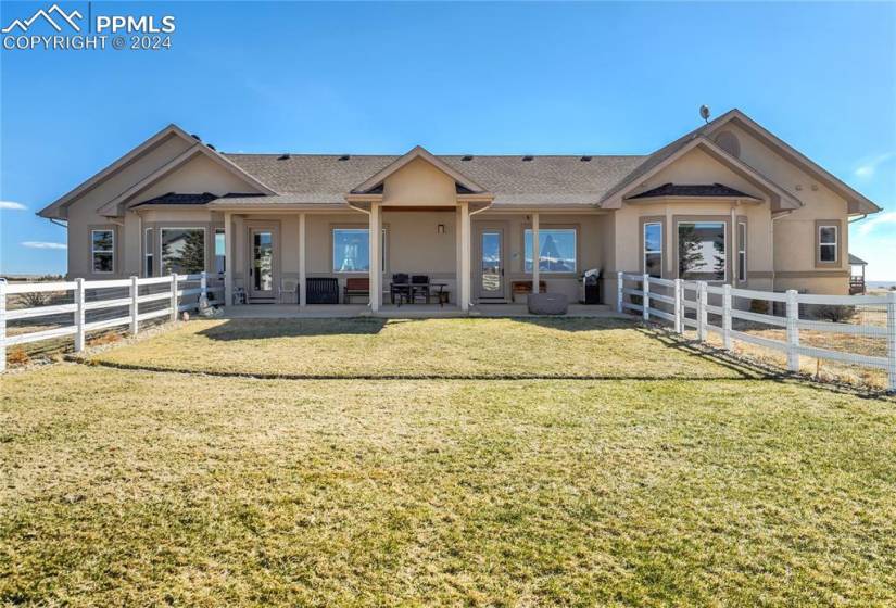 Covered Rear Patio where you can enjoy the Country Setting + Stunning Views