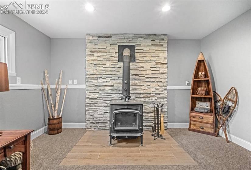Fully Renovated Lower Level Living Room with Wood Burning Stove