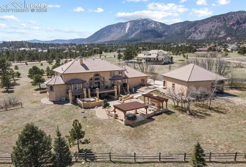 Drone / aerial view with a mountain view and a rural view