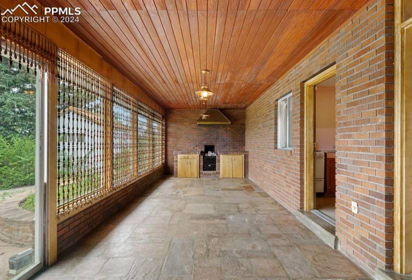 Unfurnished sunroom with wooden ceiling