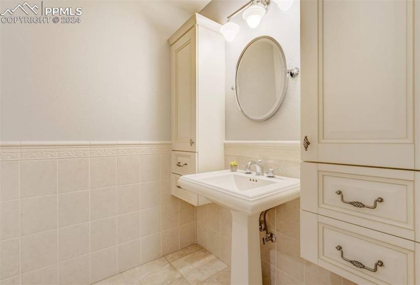 Bathroom with tile walls and tile floors