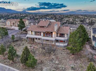 Front of home at twilight with full Range & Peak views!