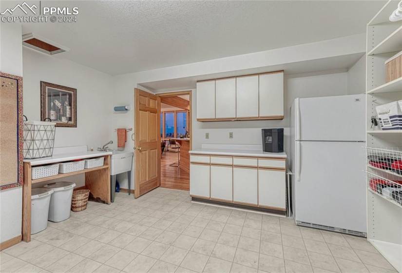 Enormous laundry room which walks out to the garage and also into the kitchen- Main level