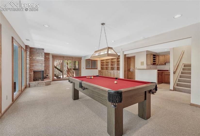 FAMILY ROOM, GAME AREA WITH POOL TABLE OVERLOOKING THE POOL ROOM