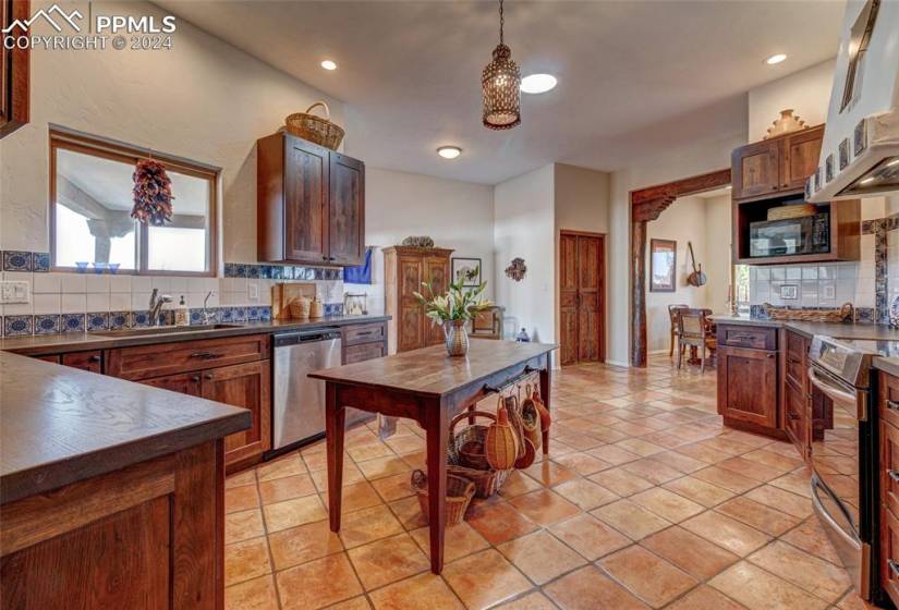 Kitchen with dining room in the distance