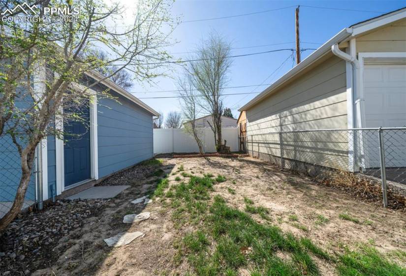 View of yard to garage service entry