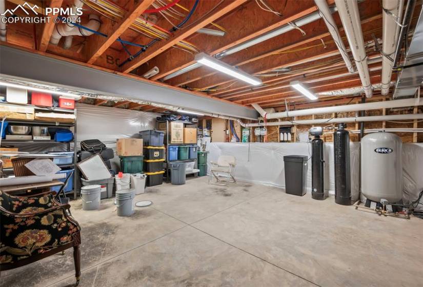 View of basement w/utilities & crawl space