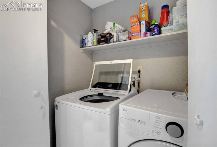 Laundry area with washer and dryer and hookup for a washing machine