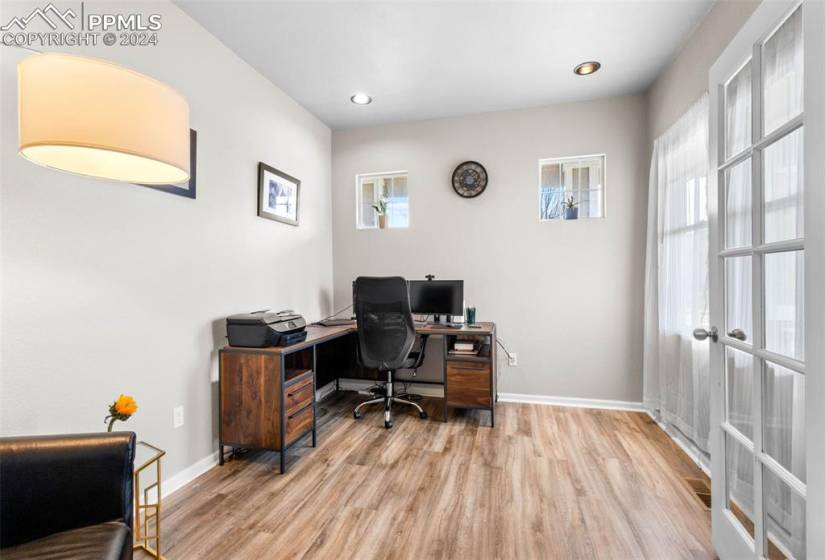 Office space featuring light hardwood / wood-style flooring
