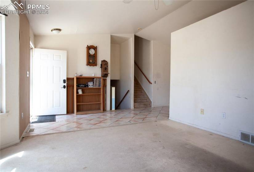 Entryway with light colored carpet