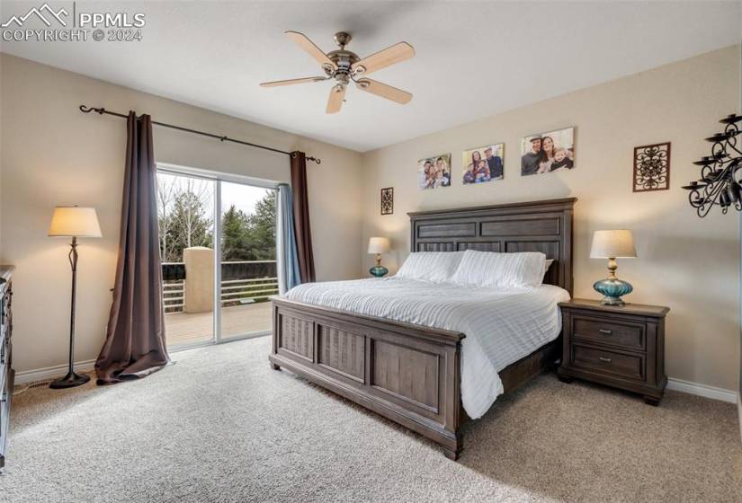 Master Bedroom with ceiling fan and access to outside deck and garden