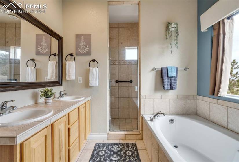 5 Piece Bathroom featuring dual bowl vanity, tile floors, and shower with separate bathtub
