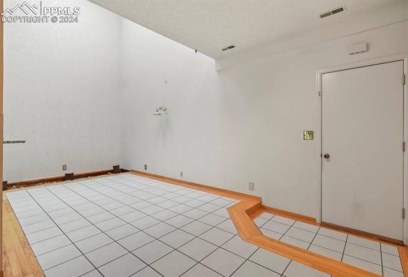 Spare room featuring light tile flooring