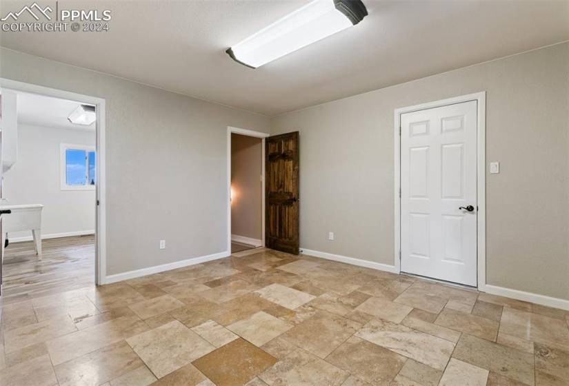 Unfurnished living room with dark hardwood / wood-style flooring and ceiling fan