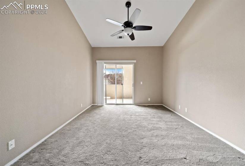 Spare room featuring carpet floors and ceiling fan
