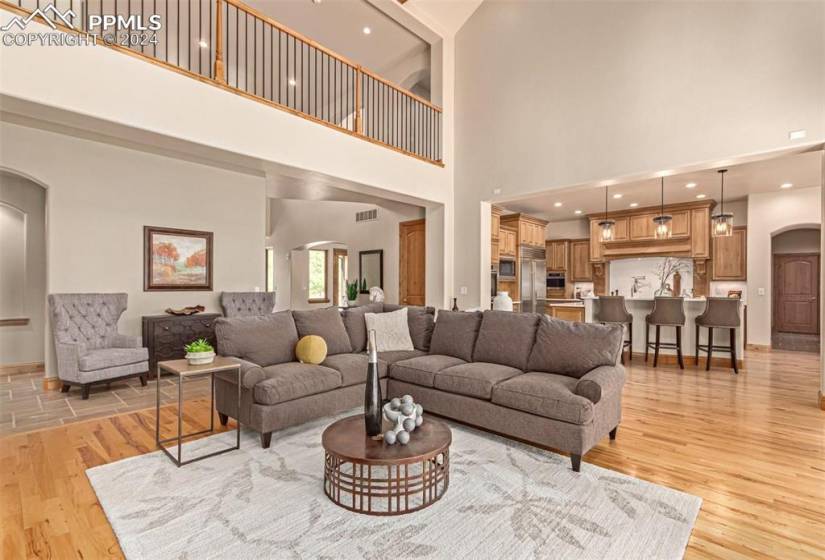 Beautiful great room with fireplace and wood beams.