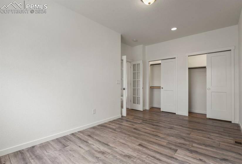 Basement living room featuring carpet and wood type flooring, wet bar
