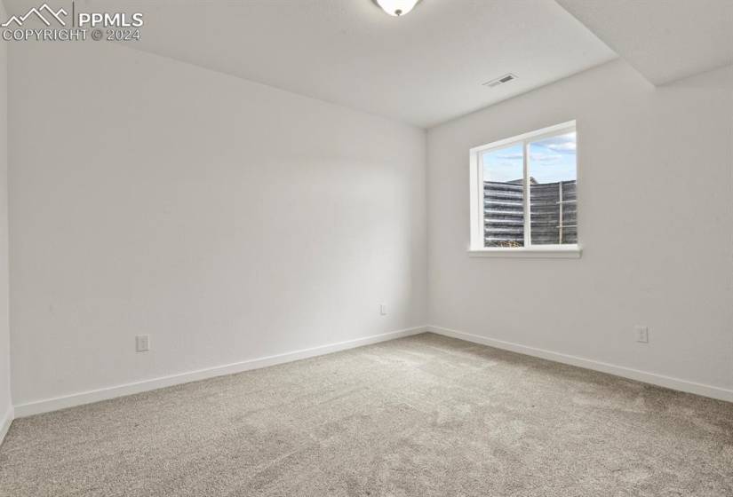 View of carpeted bedroom in basement