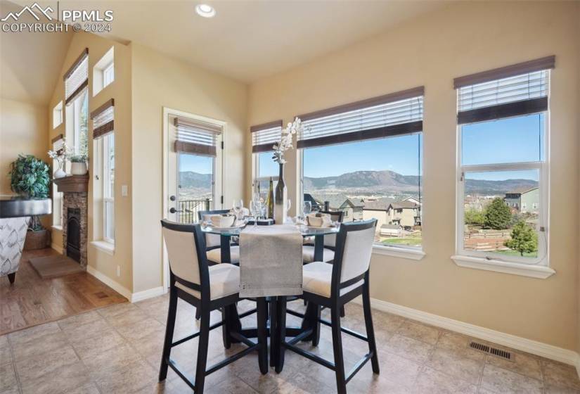 Eat-in dining space featuring a wealth of natural light and stunning views walks out to deck
