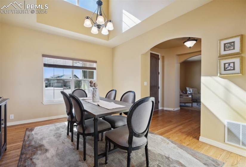 Dining area with  towering ceilings and plenty of room for large gatherings