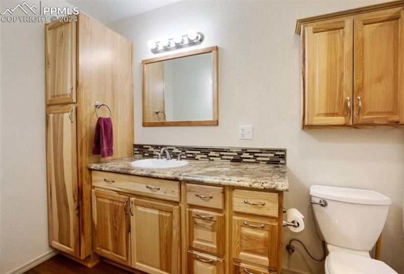 Basement bathroom with cabinetry, shower/tub combo heated floors