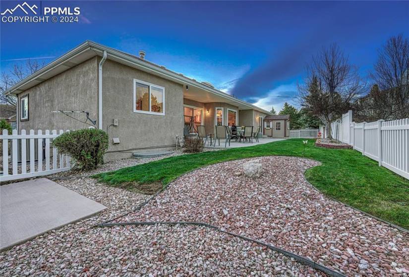 The fenced Backyard has a vinyl privacy fence, auto sprinklers, window well covers, a storage shed, & large patio.