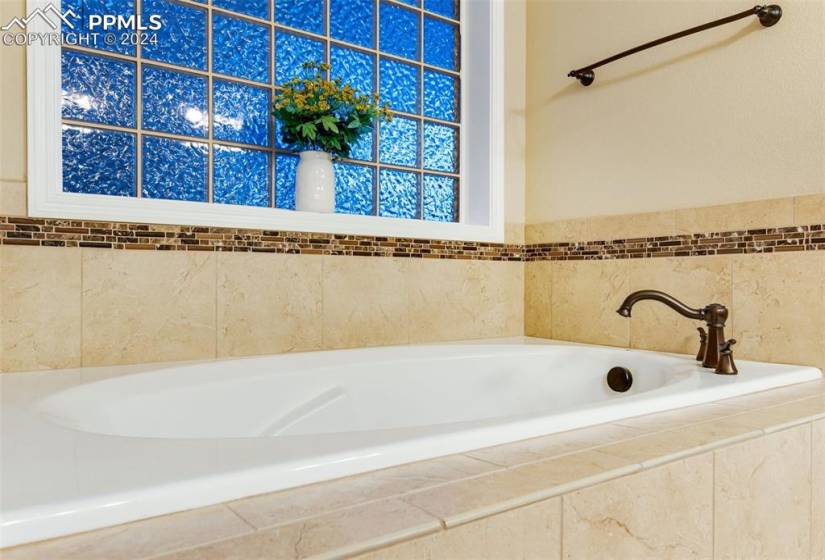Bathroom featuring tiled tub