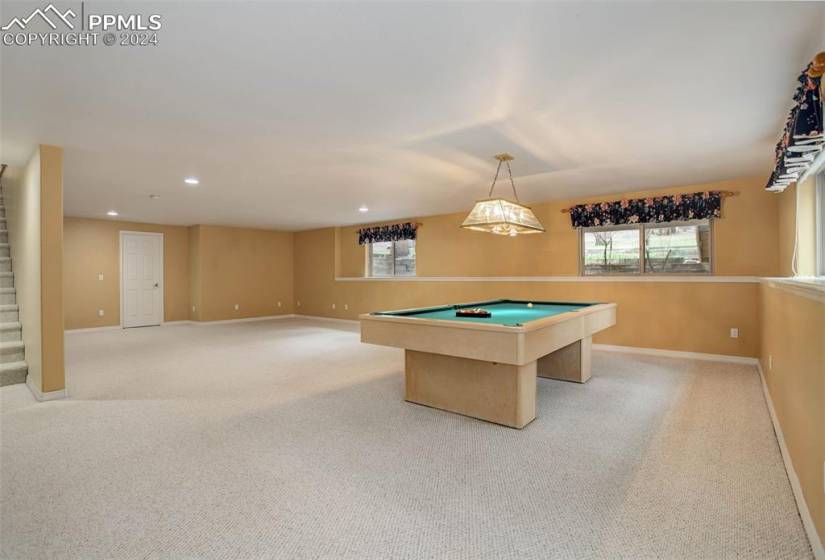 Playroom featuring light colored carpet and pool table