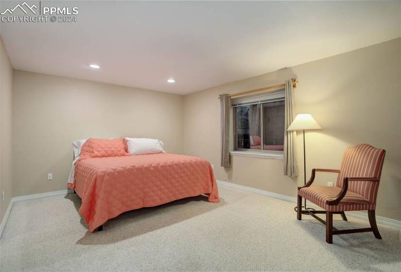 Basement bedroom with carpet flooring